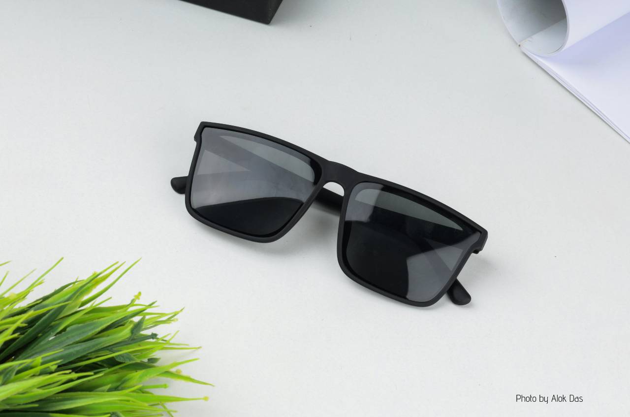 Black sunglasses on white table