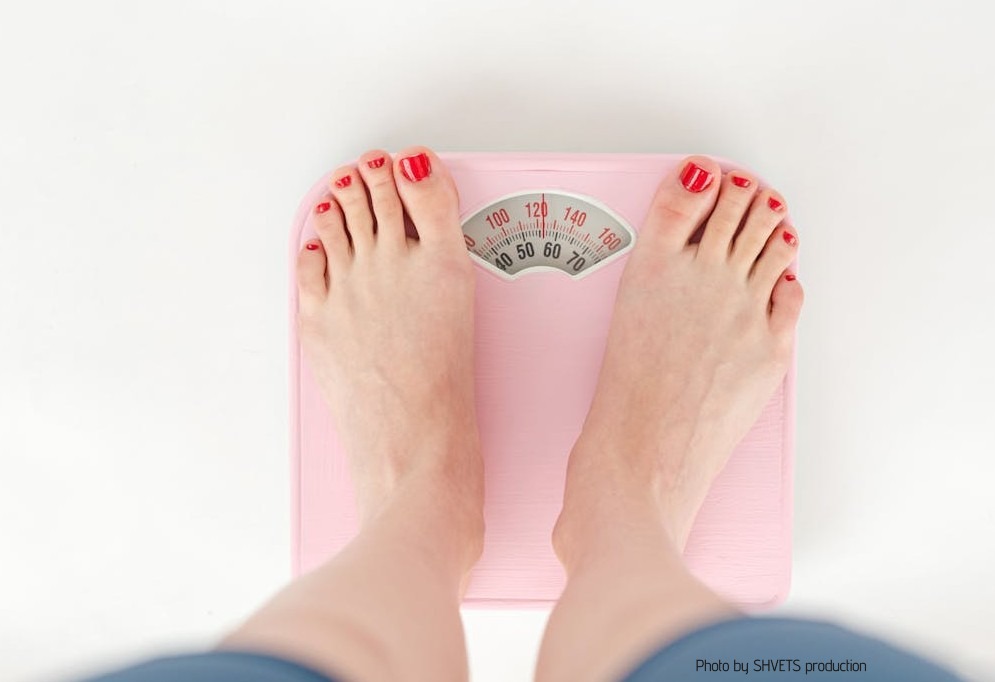 A woman on a weighing machine